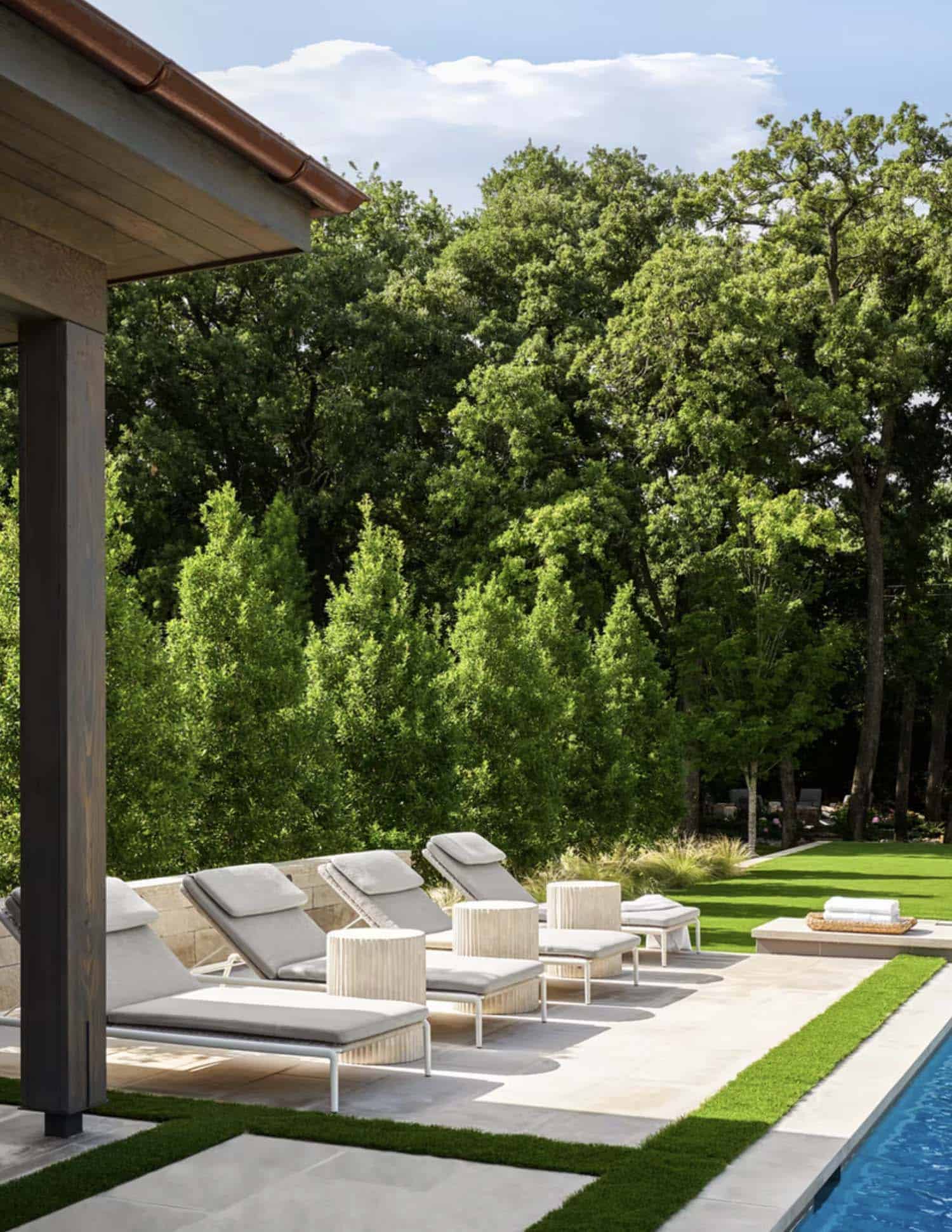 contemporary home exterior patio with sun loungers