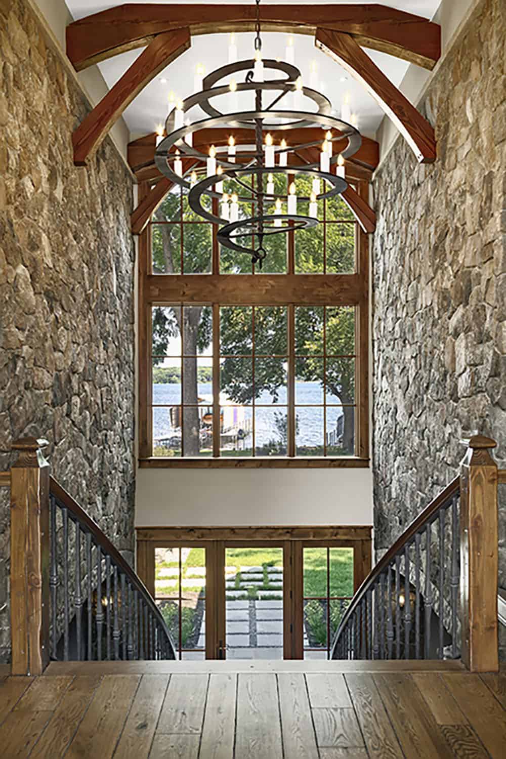 rustic front Entry with natural stone walls