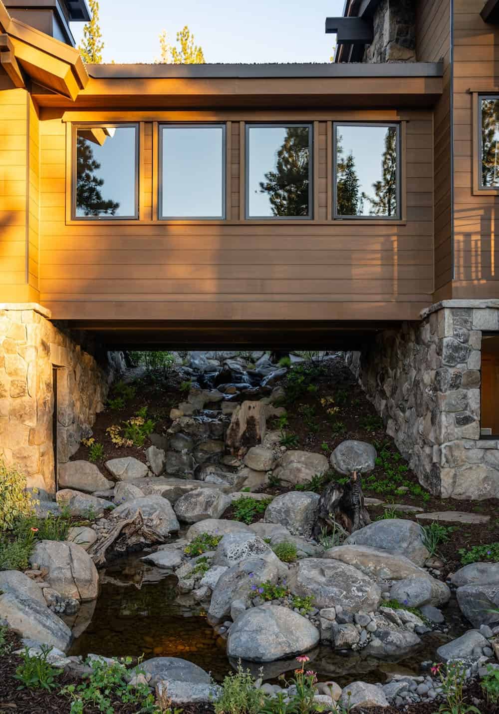Inside a home with a cascading waterfall in the peaceful Sierra Nevada mountains