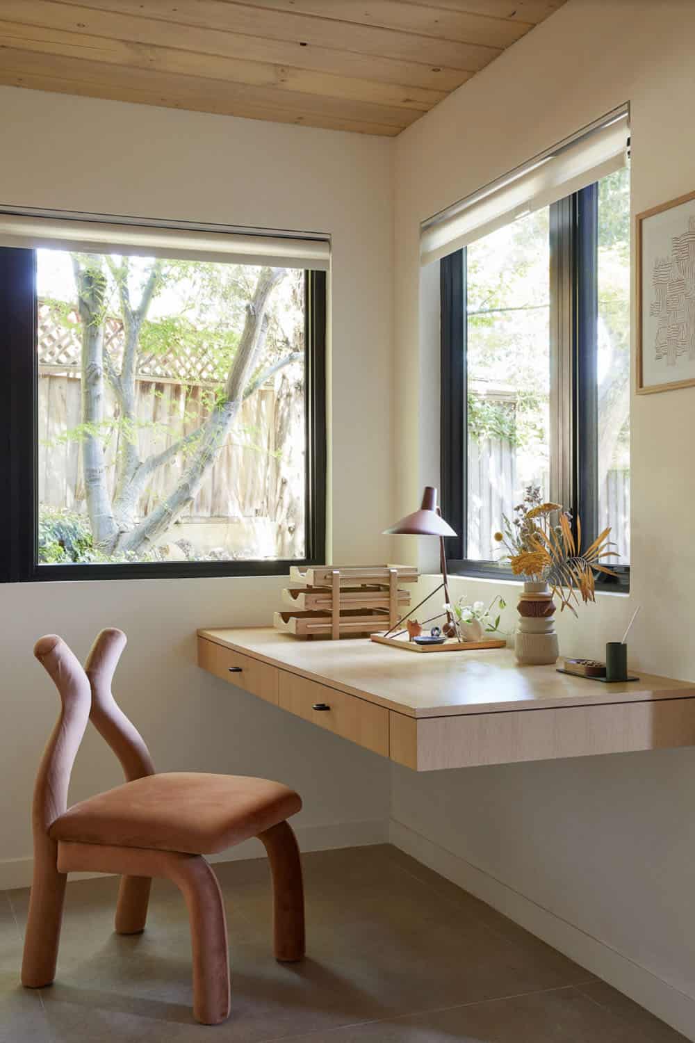 midcentury home office with a desk, chair and a window