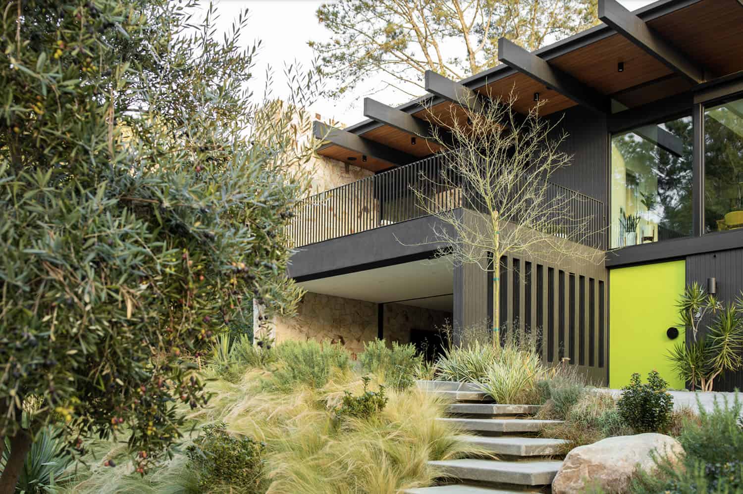 midcentury modern home exterior with stone steps