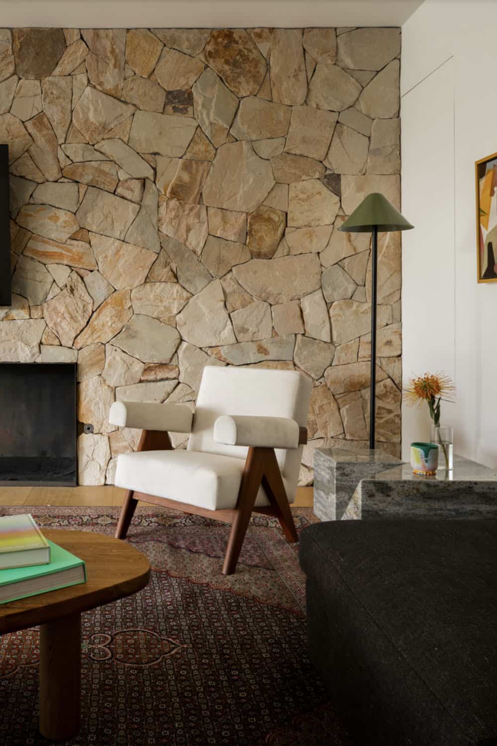 midcentury modern living room with a stone fireplace