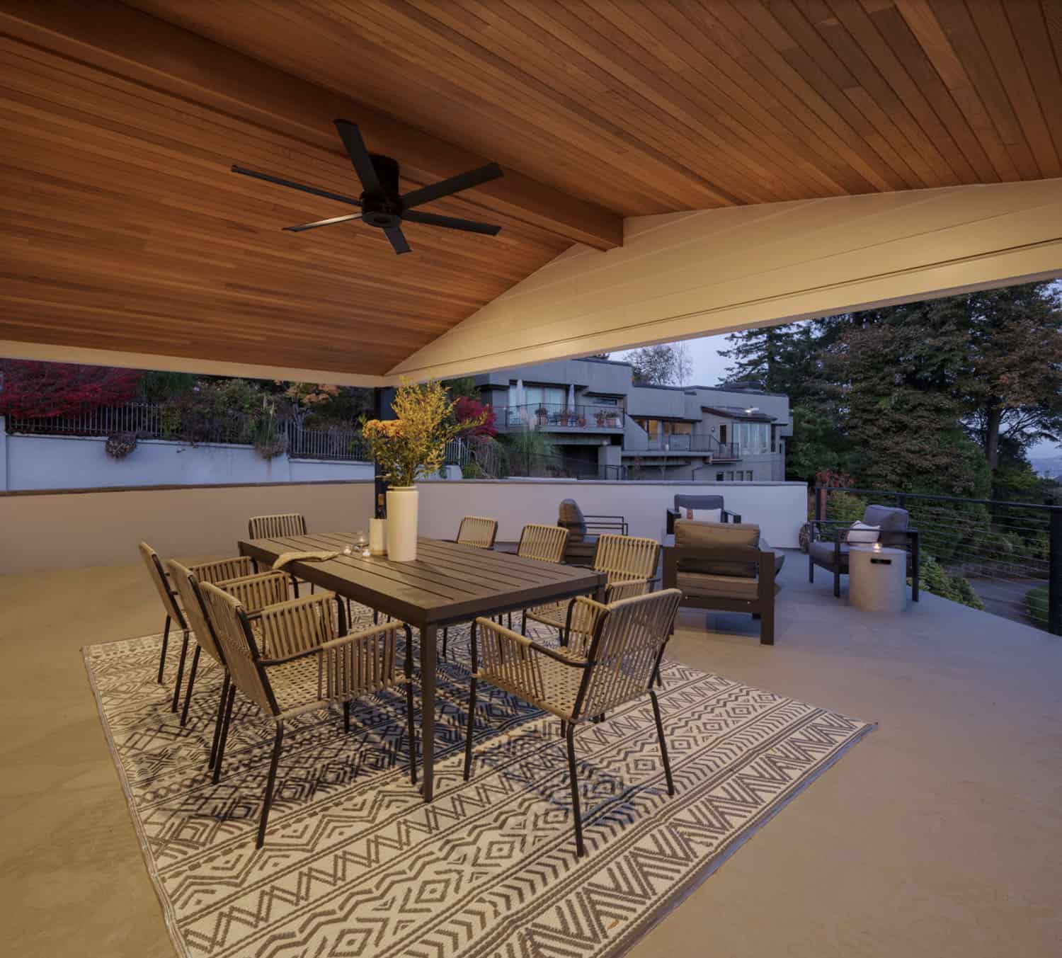 midcentury modern home exterior with a covered patio and alfresco dining