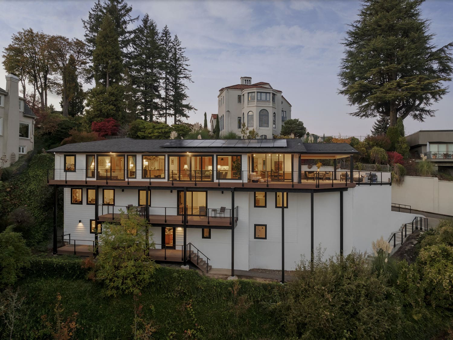midcentury modern home exterior at dusk