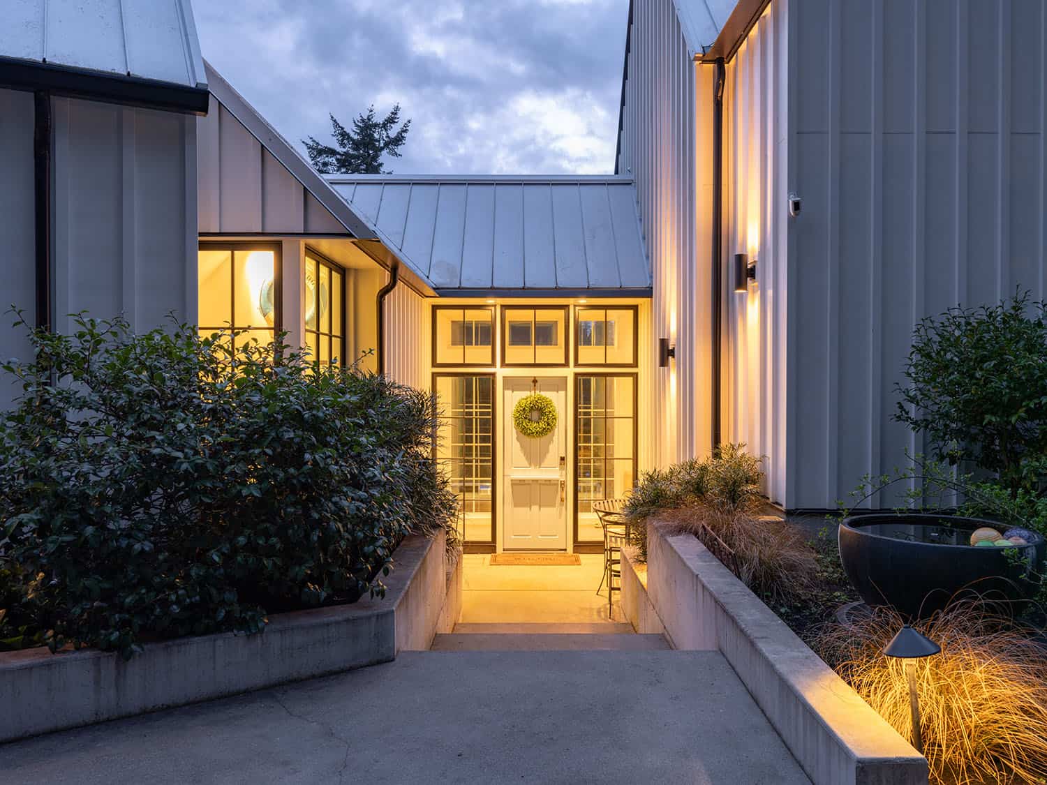 modern farmhouse style house exterior at dusk