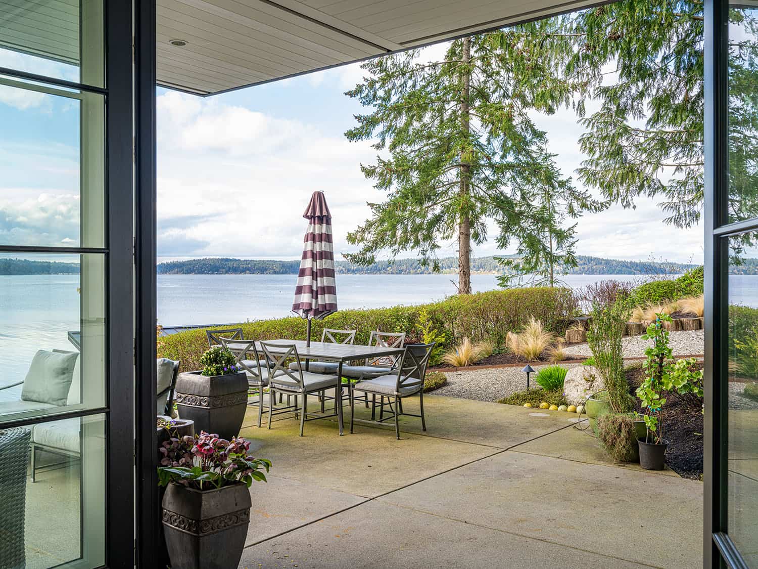 modern waterfront home exterior patio