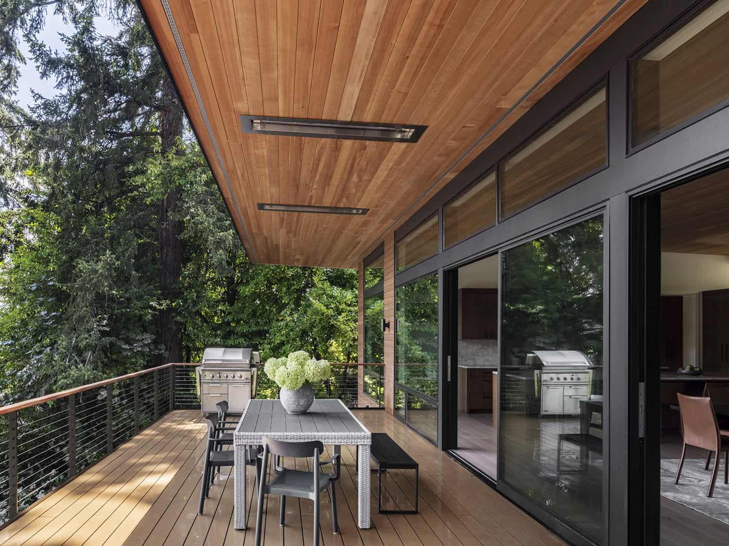 modern lake house exterior. with a covered patio and integrated heaters