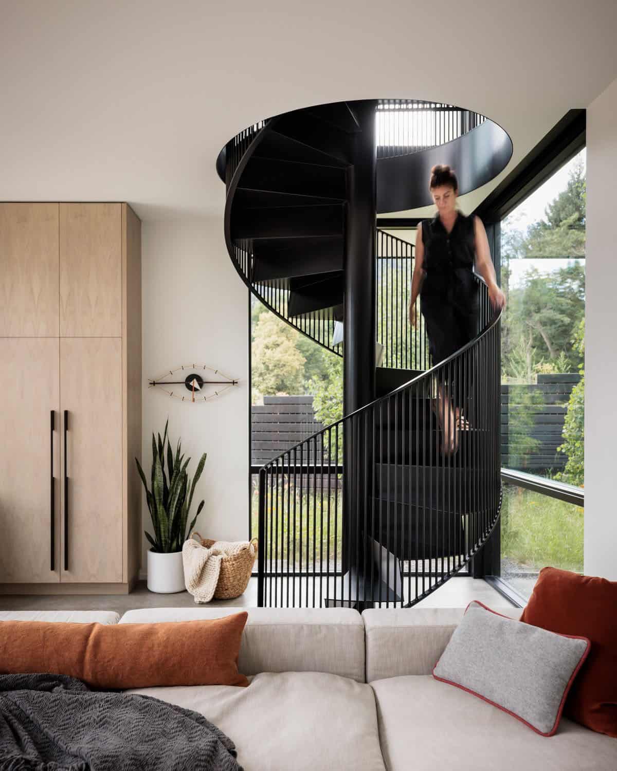 modern family room with a spiral staircase