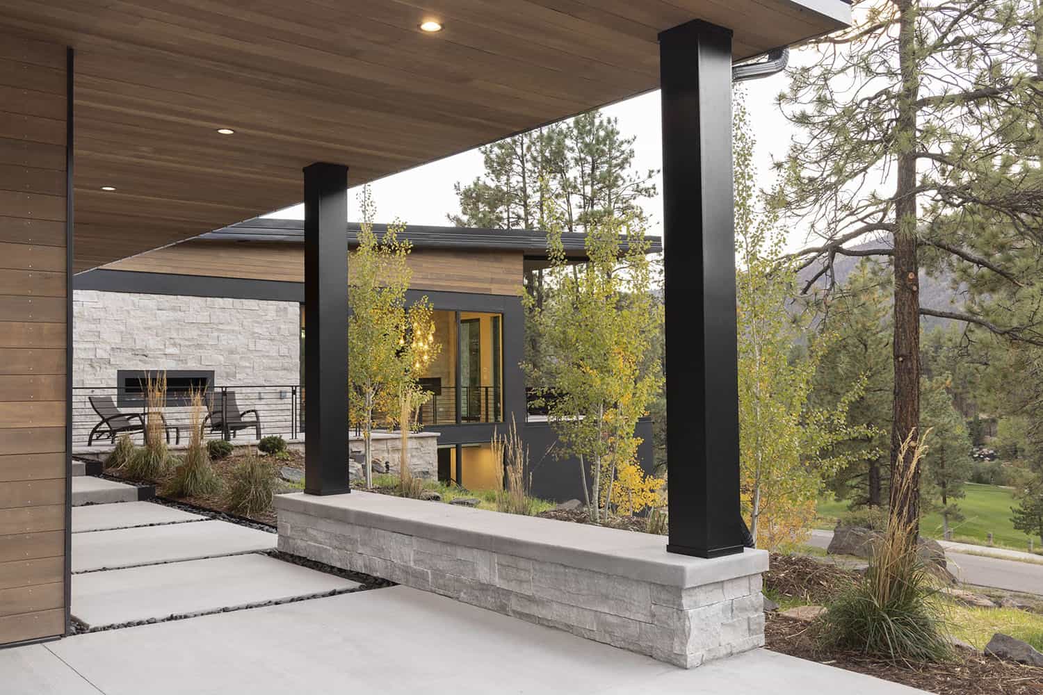 modern mountain home exterior with a covered walkway
