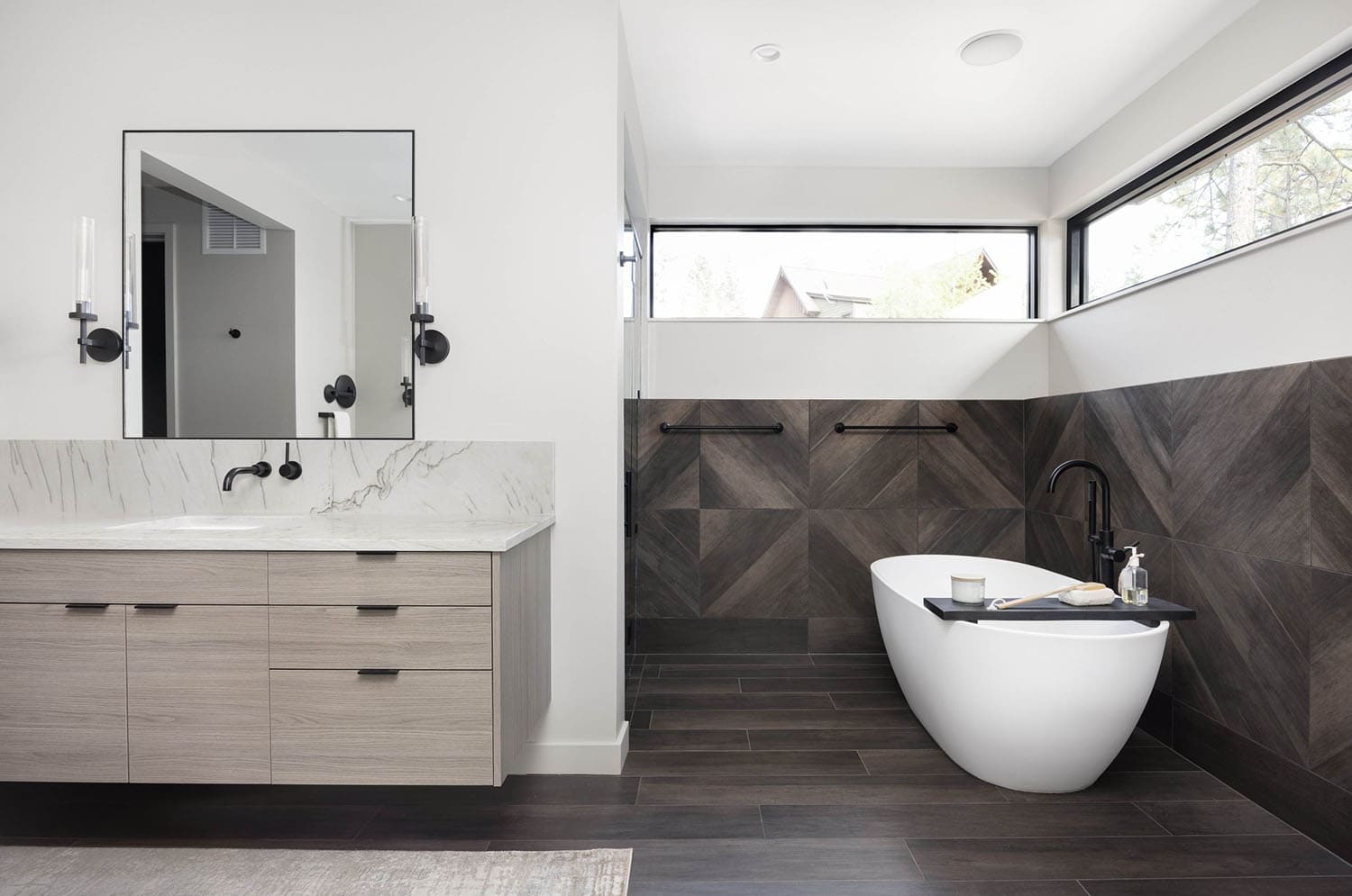 modern bathroom with a vanity and freestanding tub