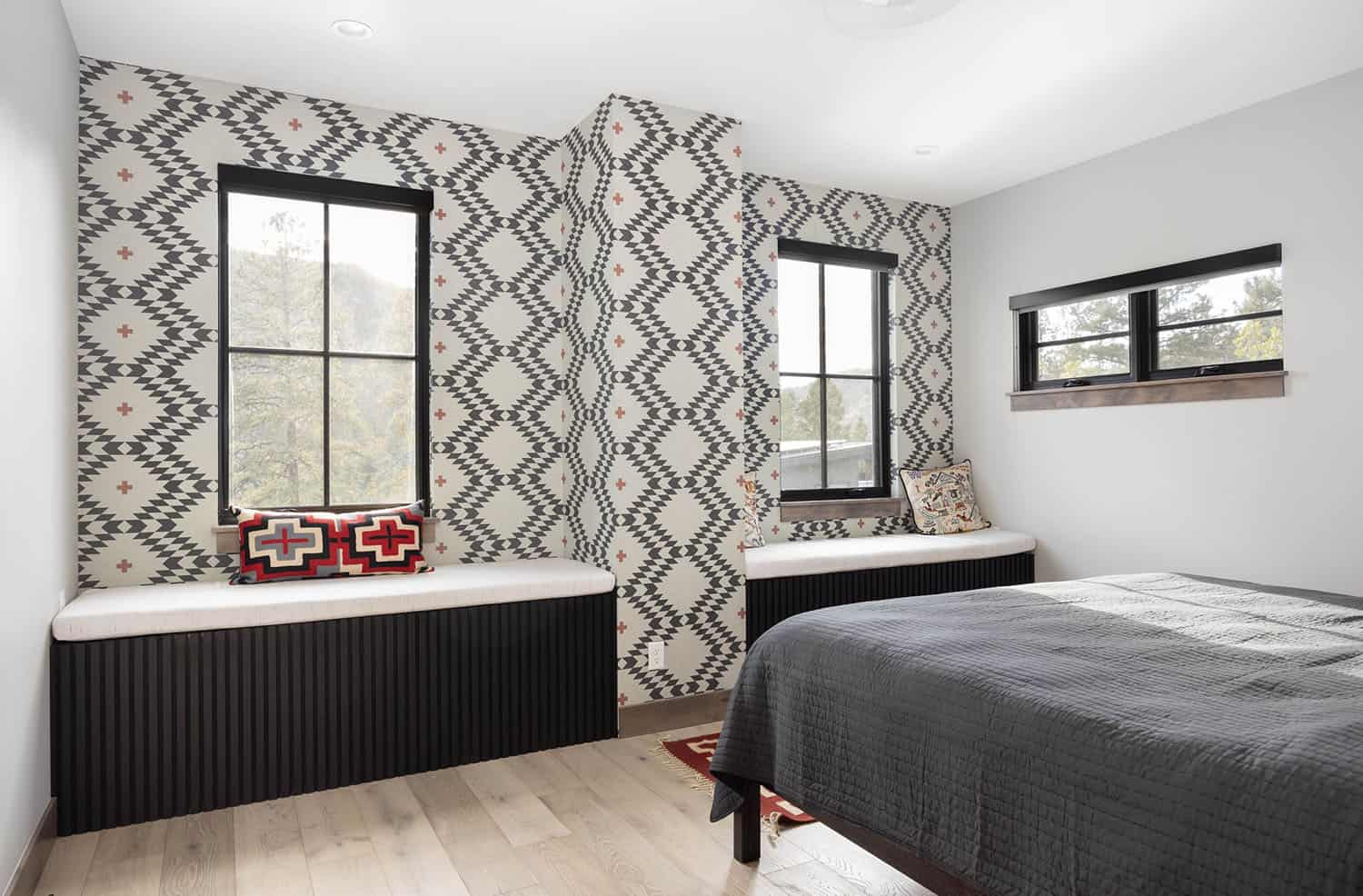 contemporary bedroom with built-in window seats