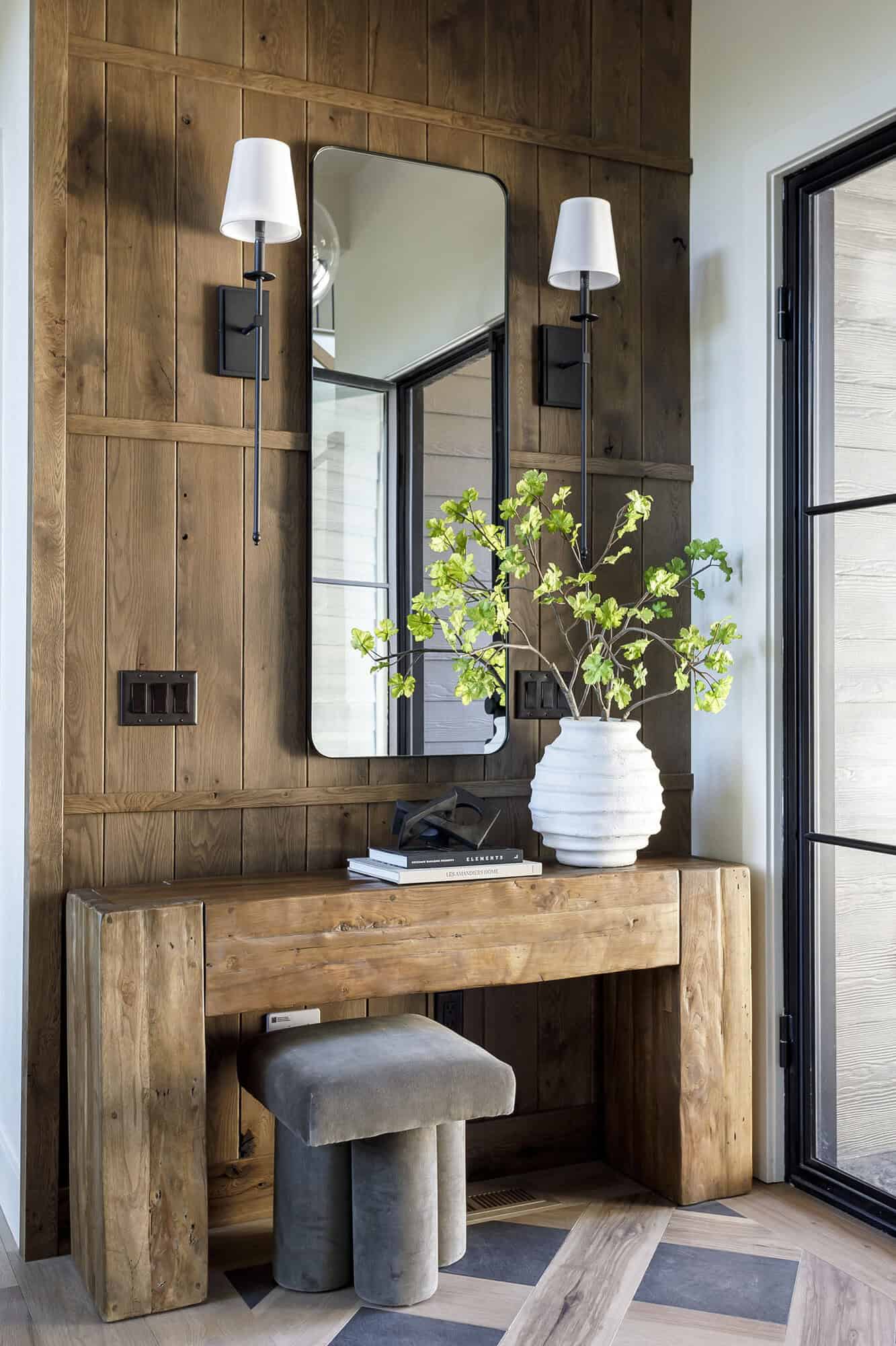 rustic mountain home entry with a console table
