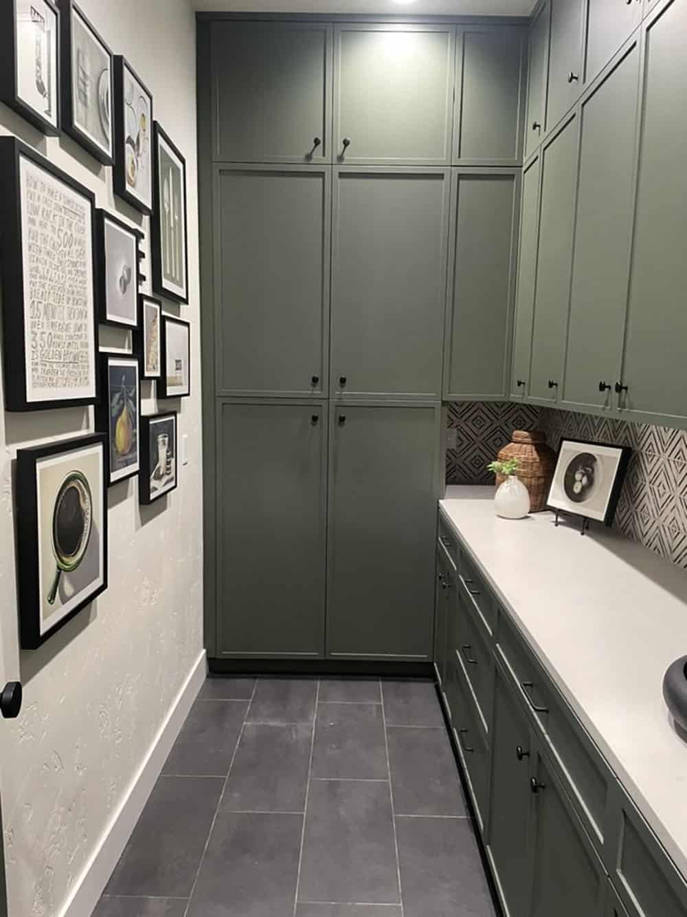 Pantry off the kitchen with lots of storage, counter space, and a gallery wall