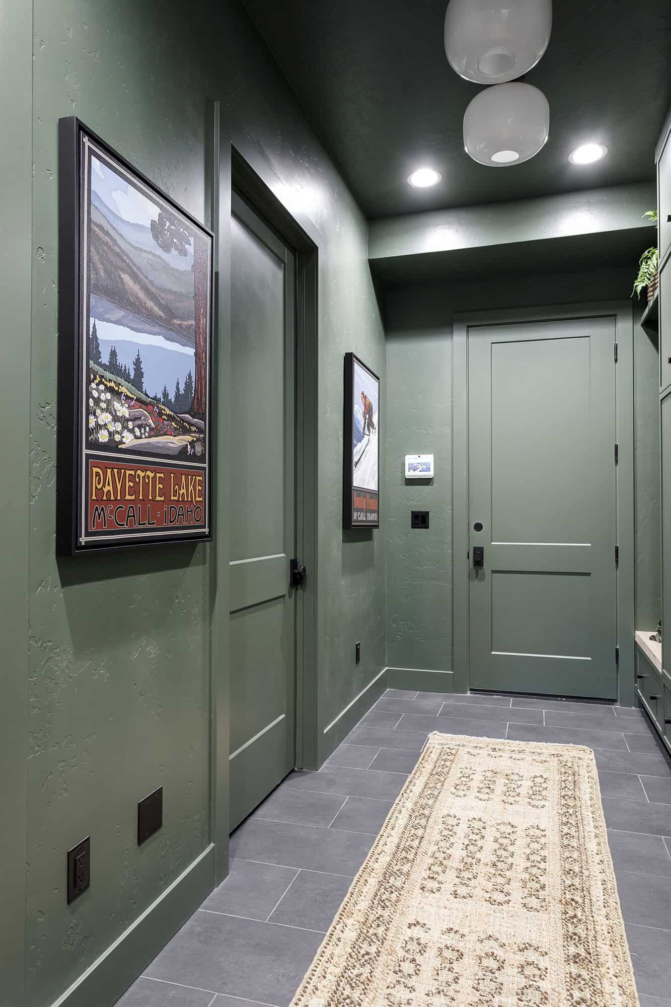 Mudroom with green everything except the tile floor
