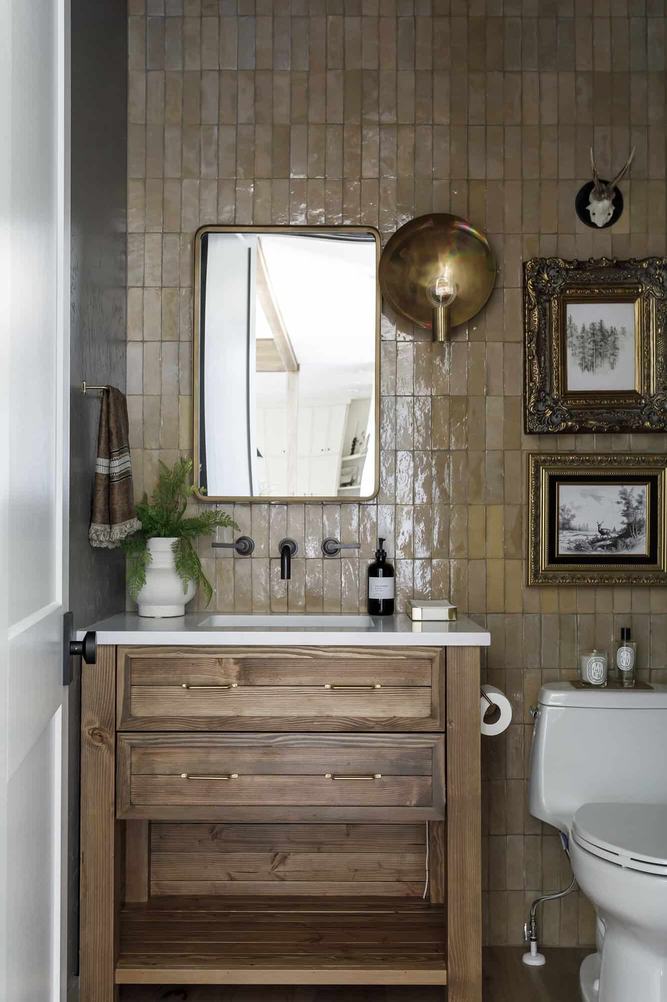 dark and moody powder room with Zellige tile whole wall backsplash
