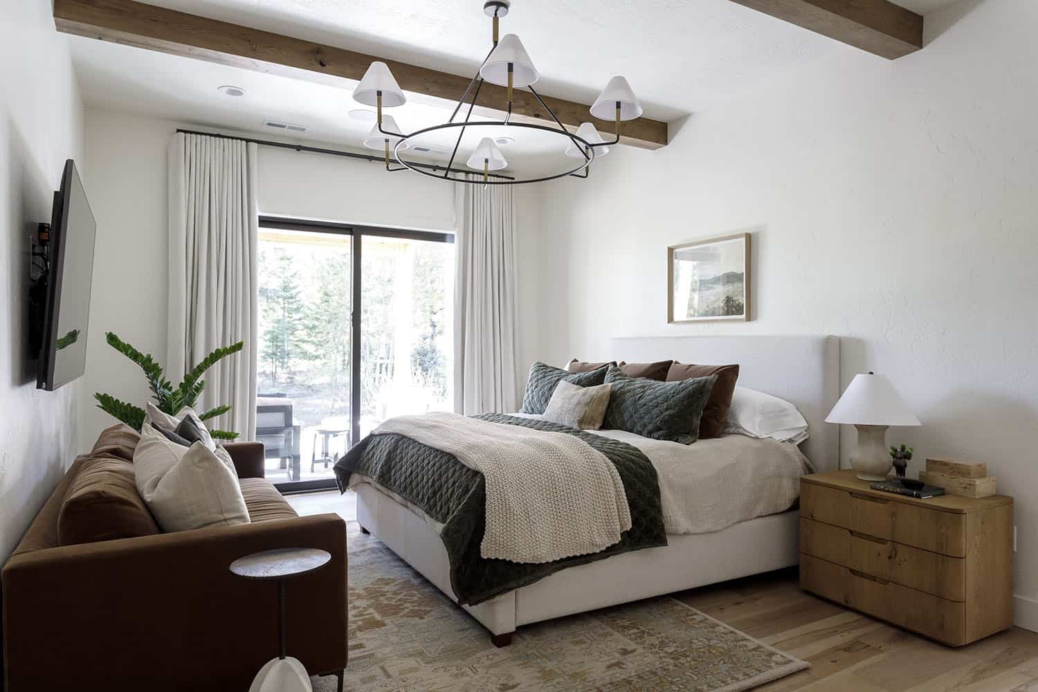 rustic bedroom with wood ceiling beams