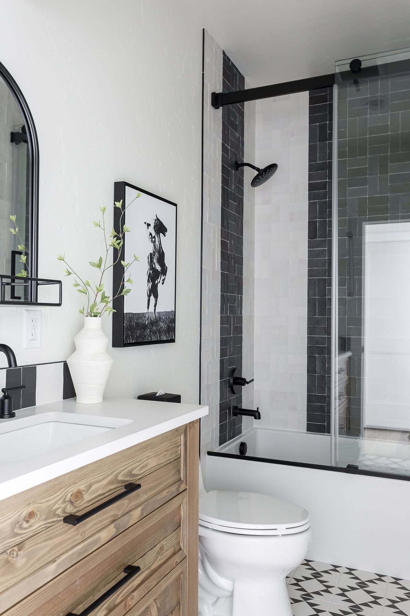rustic vanity, tiled shower, and floor