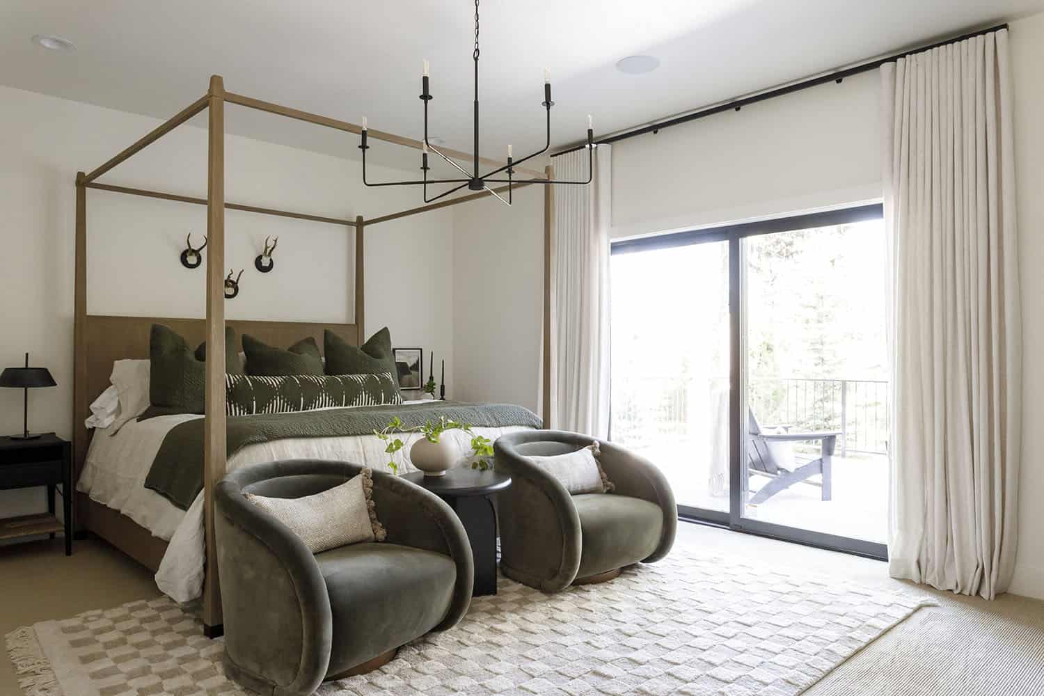 rustic bedroom with chairs at the foot of the bed