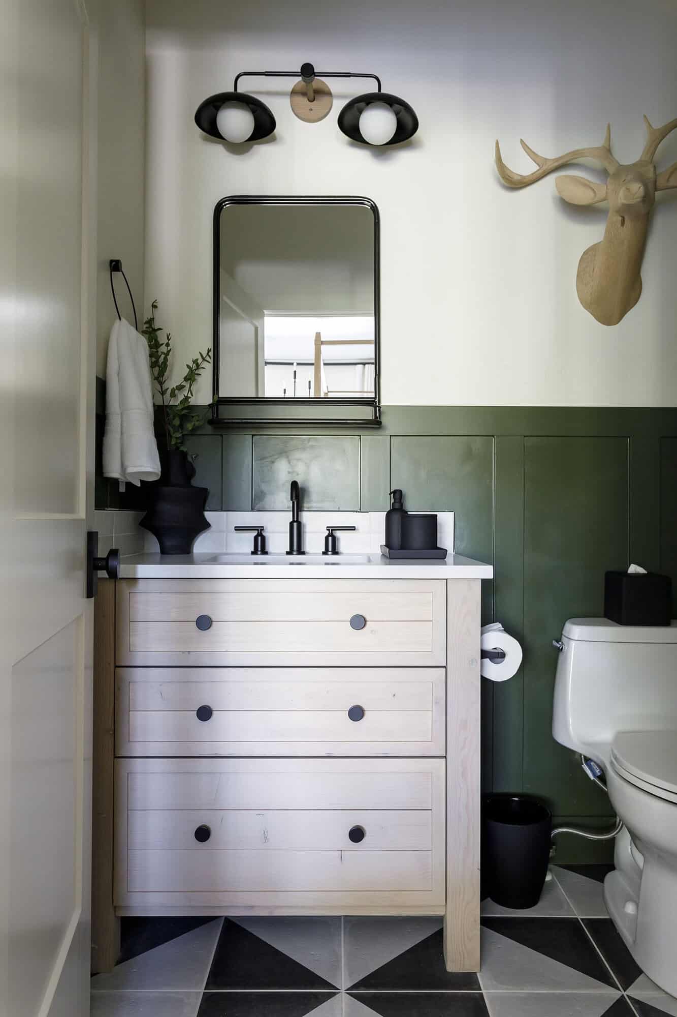 rustic bathroom with green wainscoating
