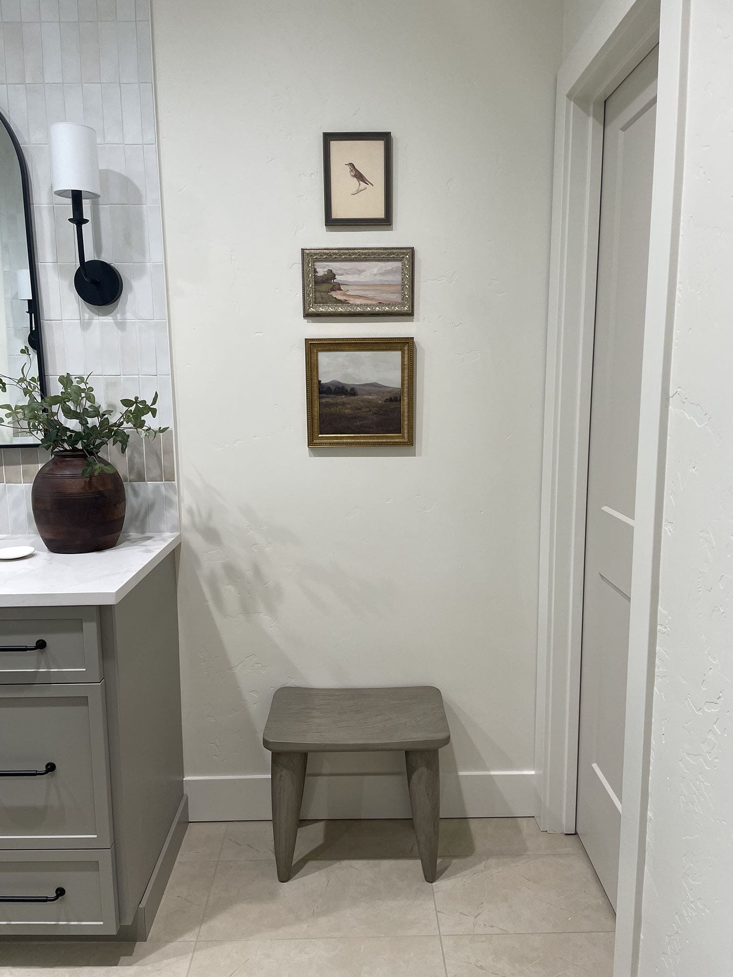 rustic bathroom with split vanities, wet room, and Zellige tile