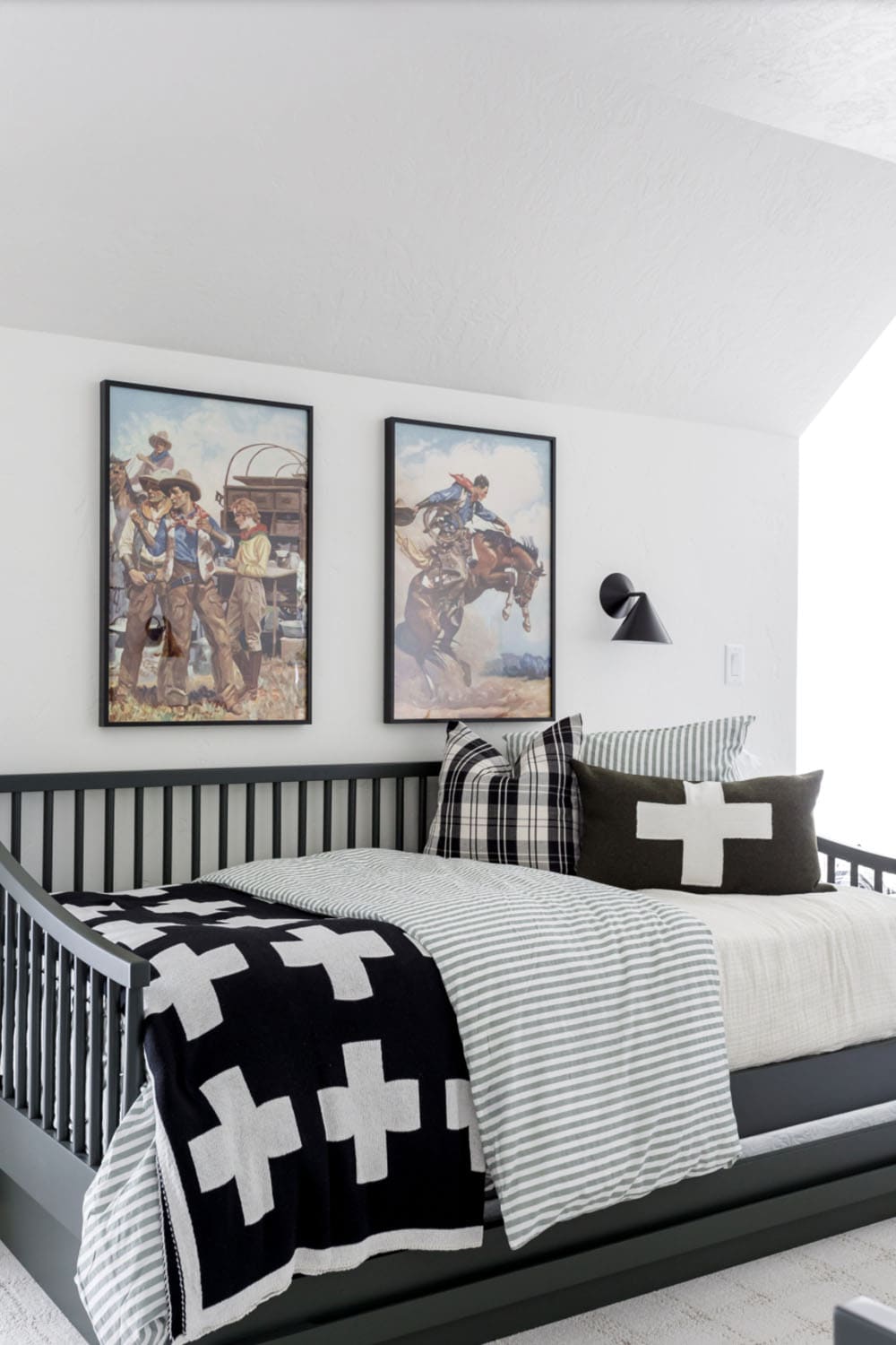 rustic kids' bunk room with a trundle bed