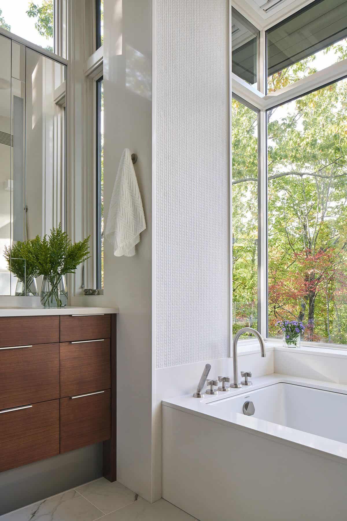 modern bathroom with a vanity and integrated tub