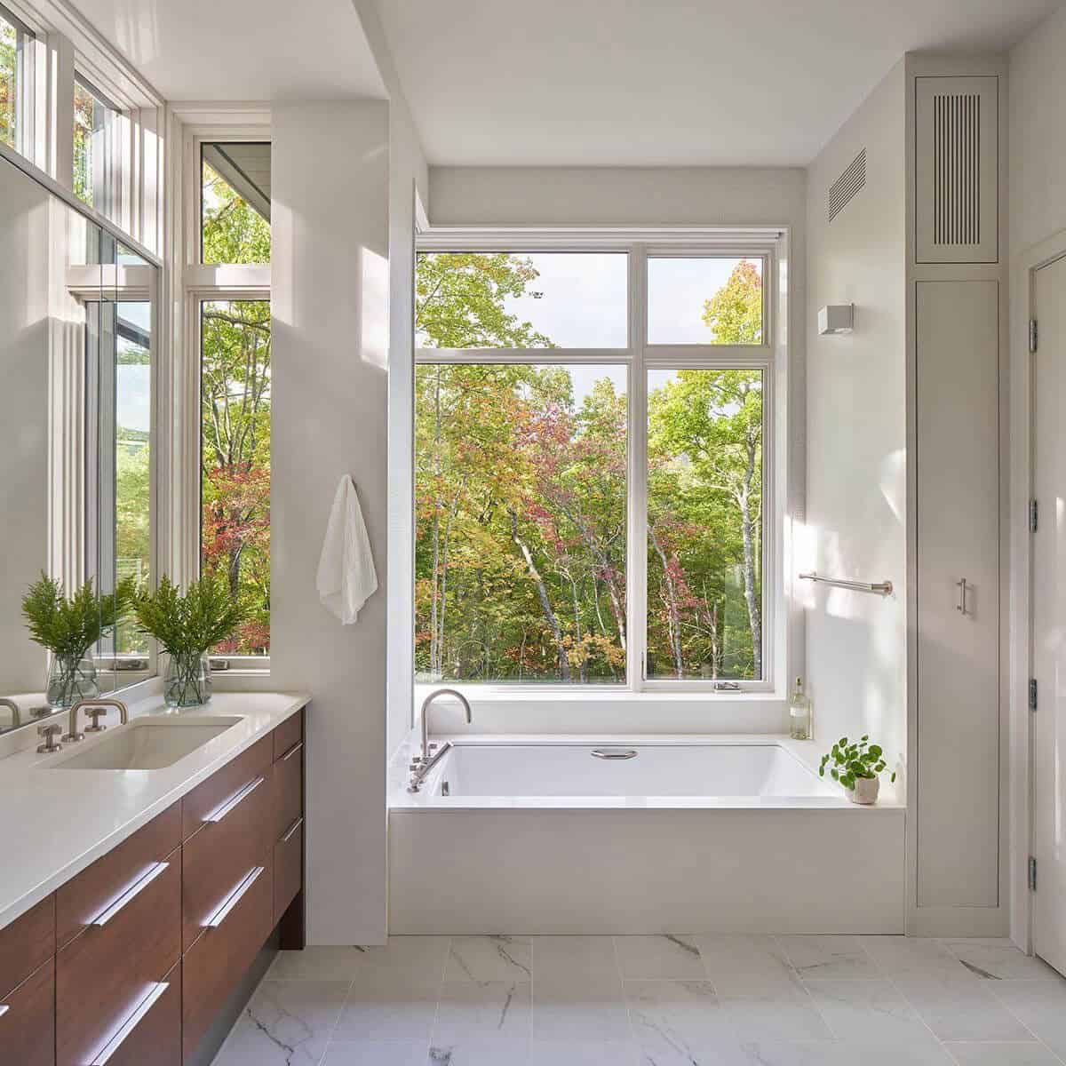 modern bathroom with a vanity and integrated tub