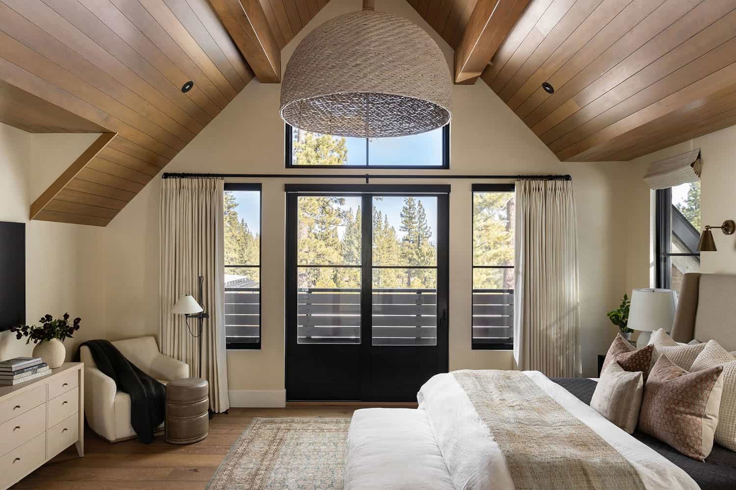 modern farmhouse style bedroom with french doors leading out to a private balcony