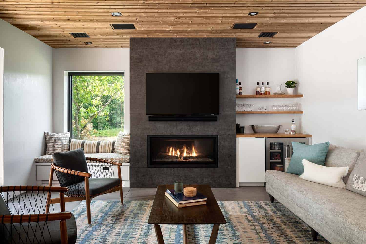 A modern living room with a fireplace and a television