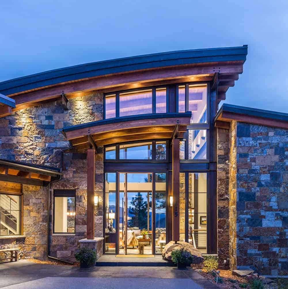contemporary mountain home exterior at dusk