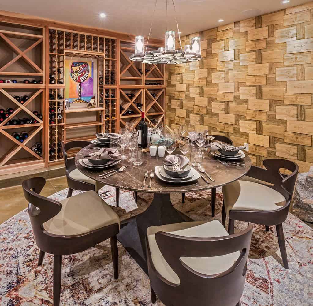 A wine cellar with a table and chairs