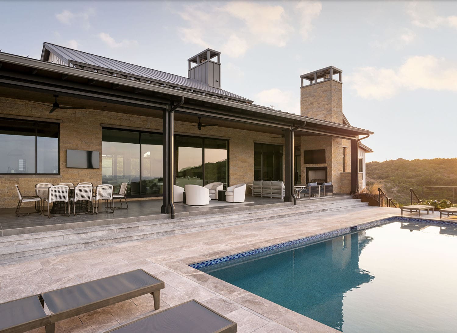 farmhouse style home exterior with a pool