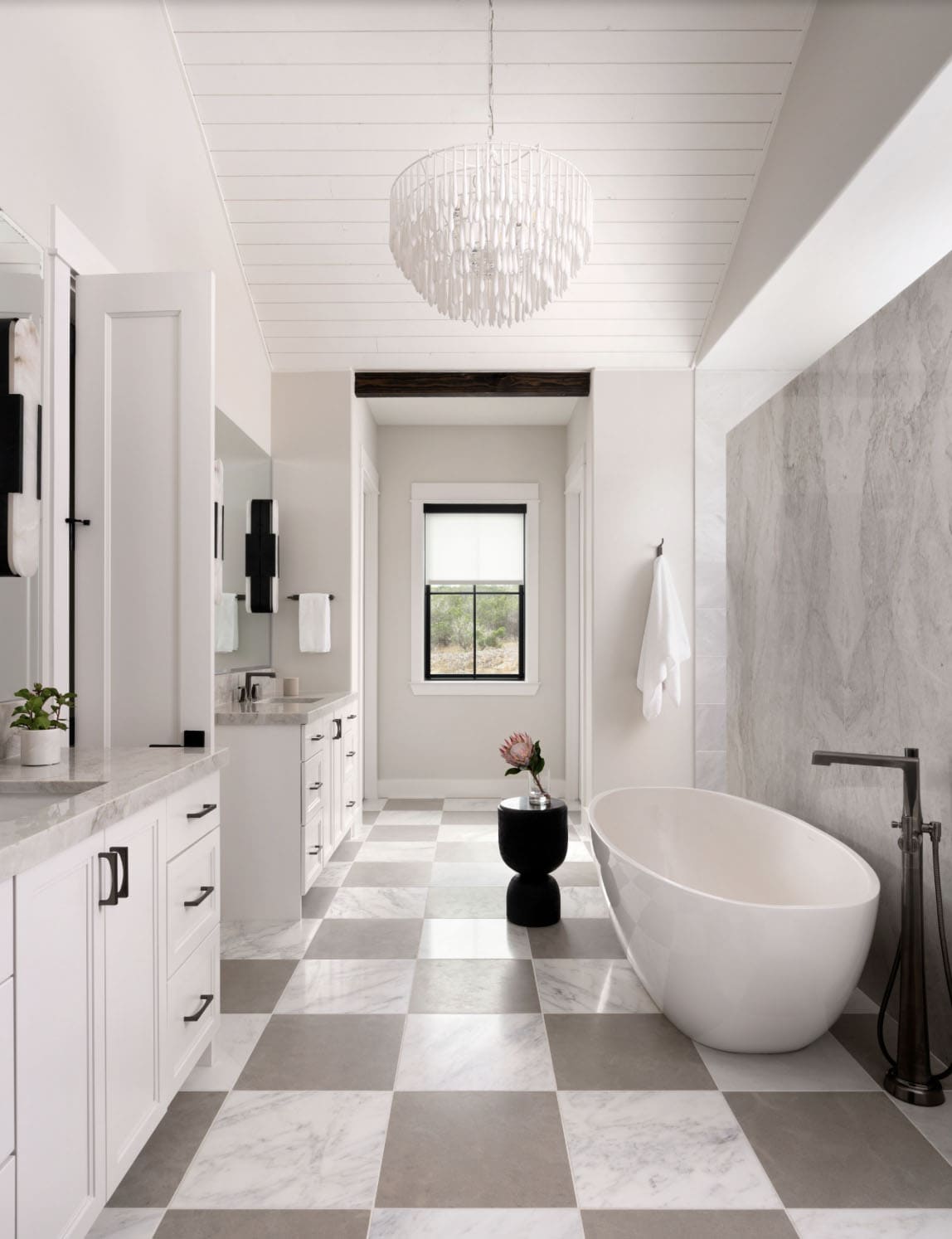 organic modern bathroom with a freestanding tub and vanity