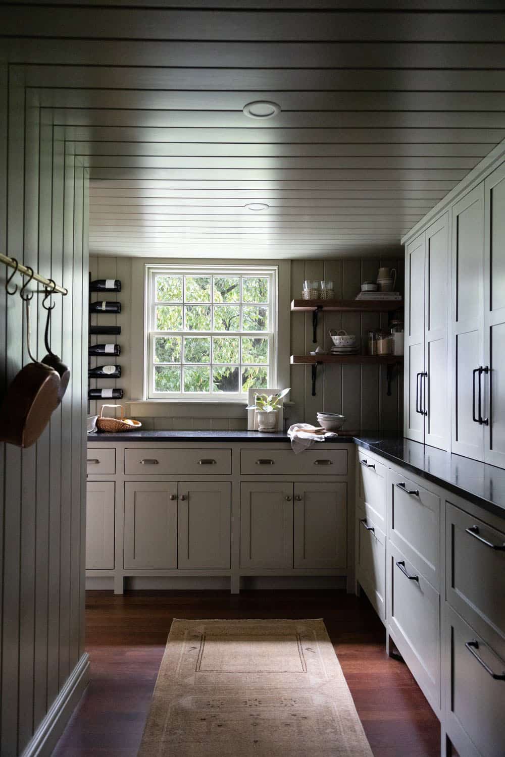 contemporary kitchen pantry with a window