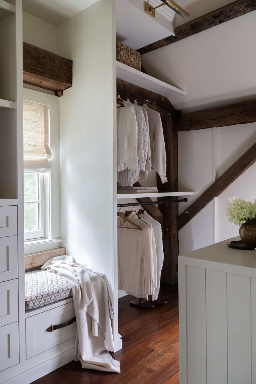 contemporary walk-in closet with a window