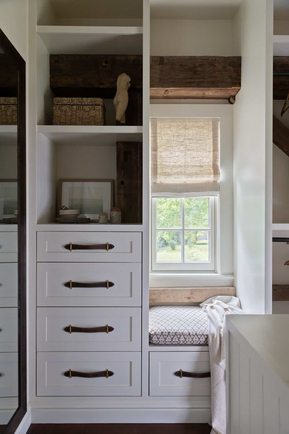 contemporary walk-in closet with a window