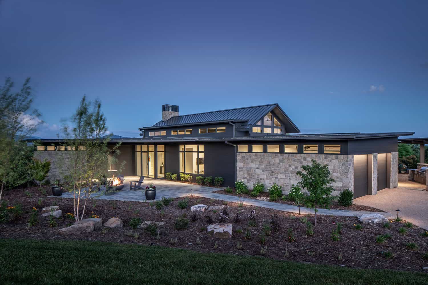 mountain modern home exterior at dusk