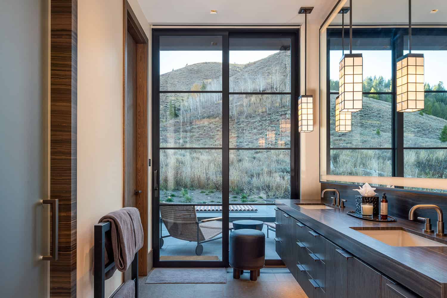 modern bathroom with a sliding glass door leading out to the patio