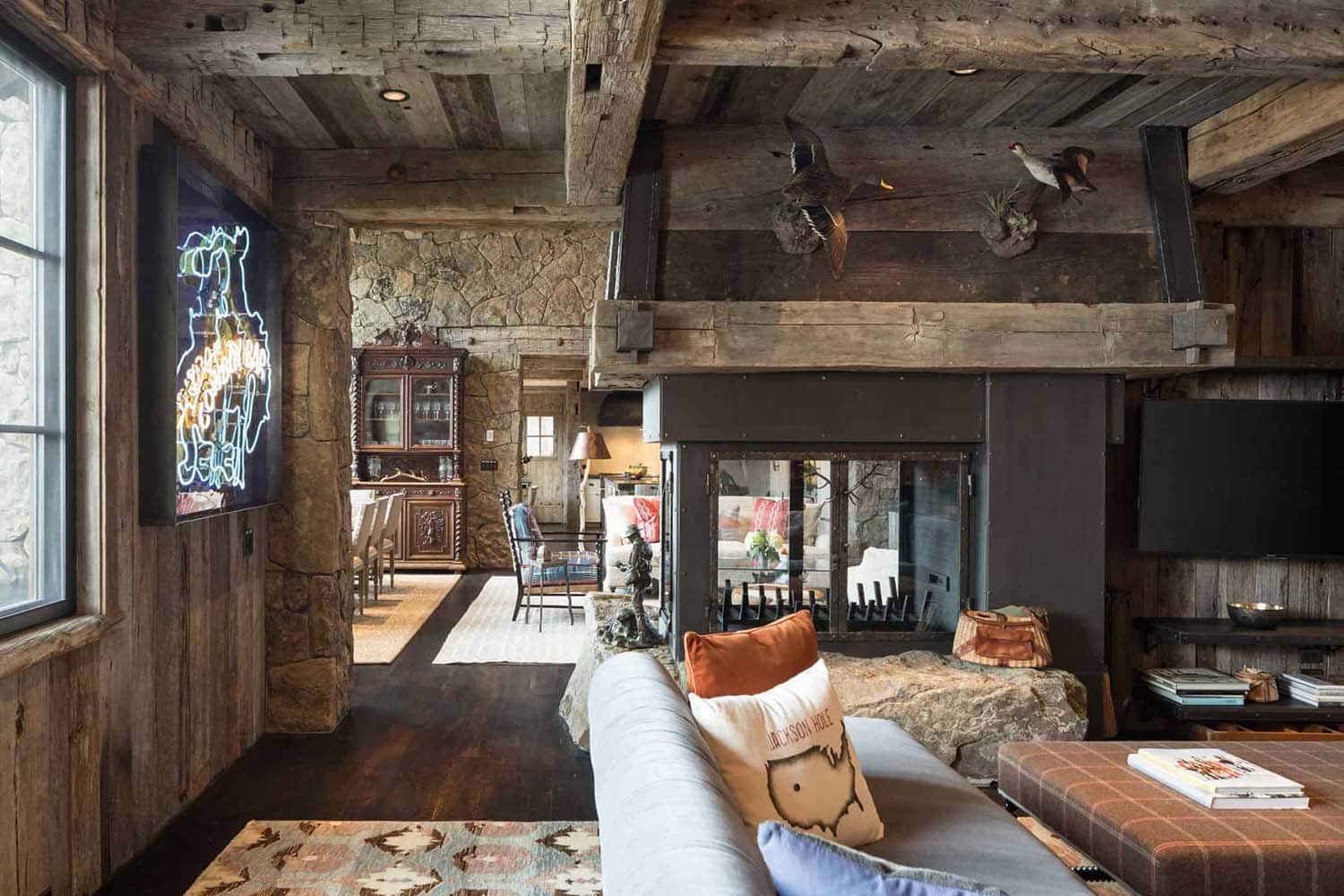 rustic modern living room with a dual-sided fireplace