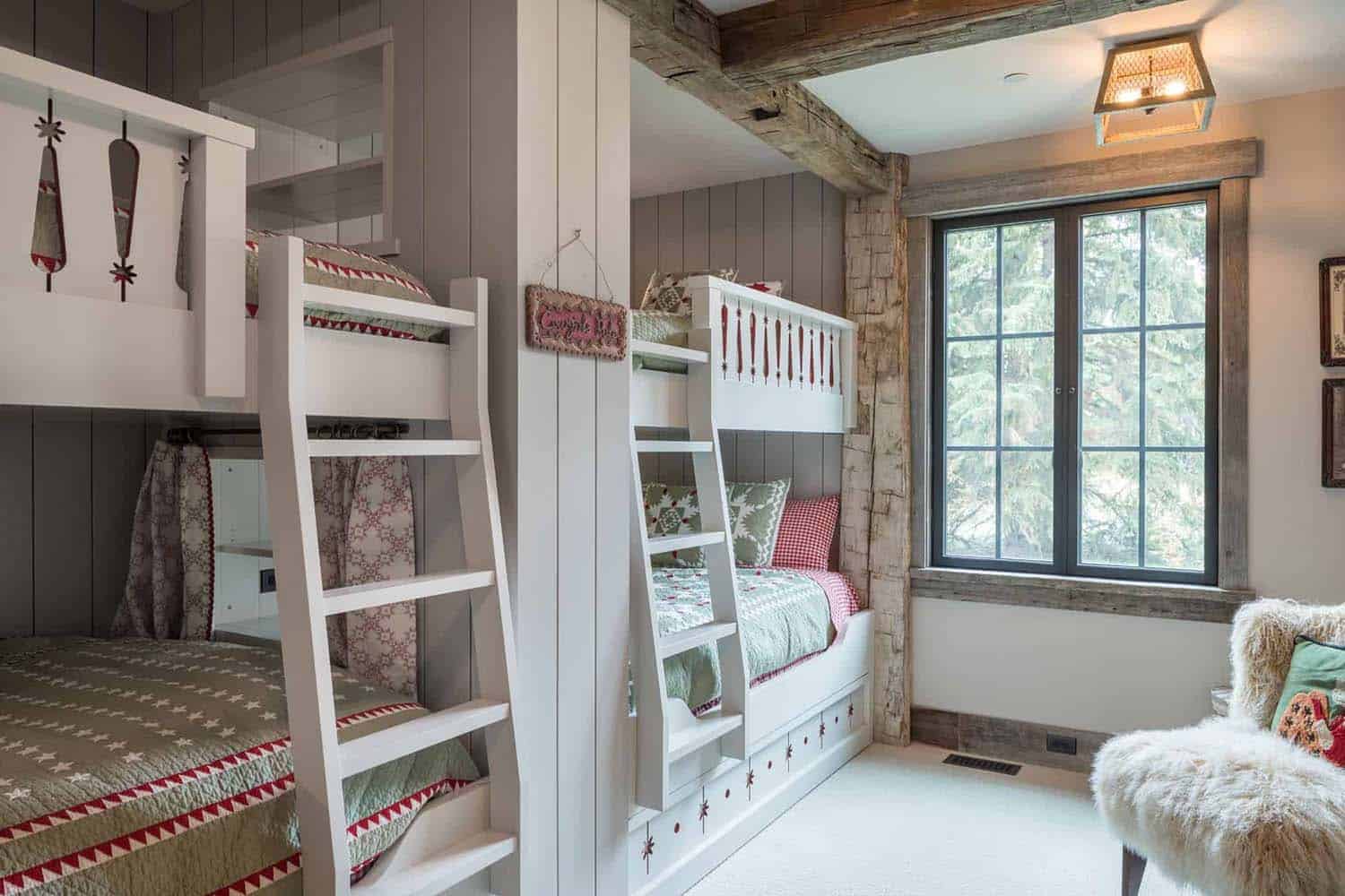 A bedroom with bunk beds and a chair