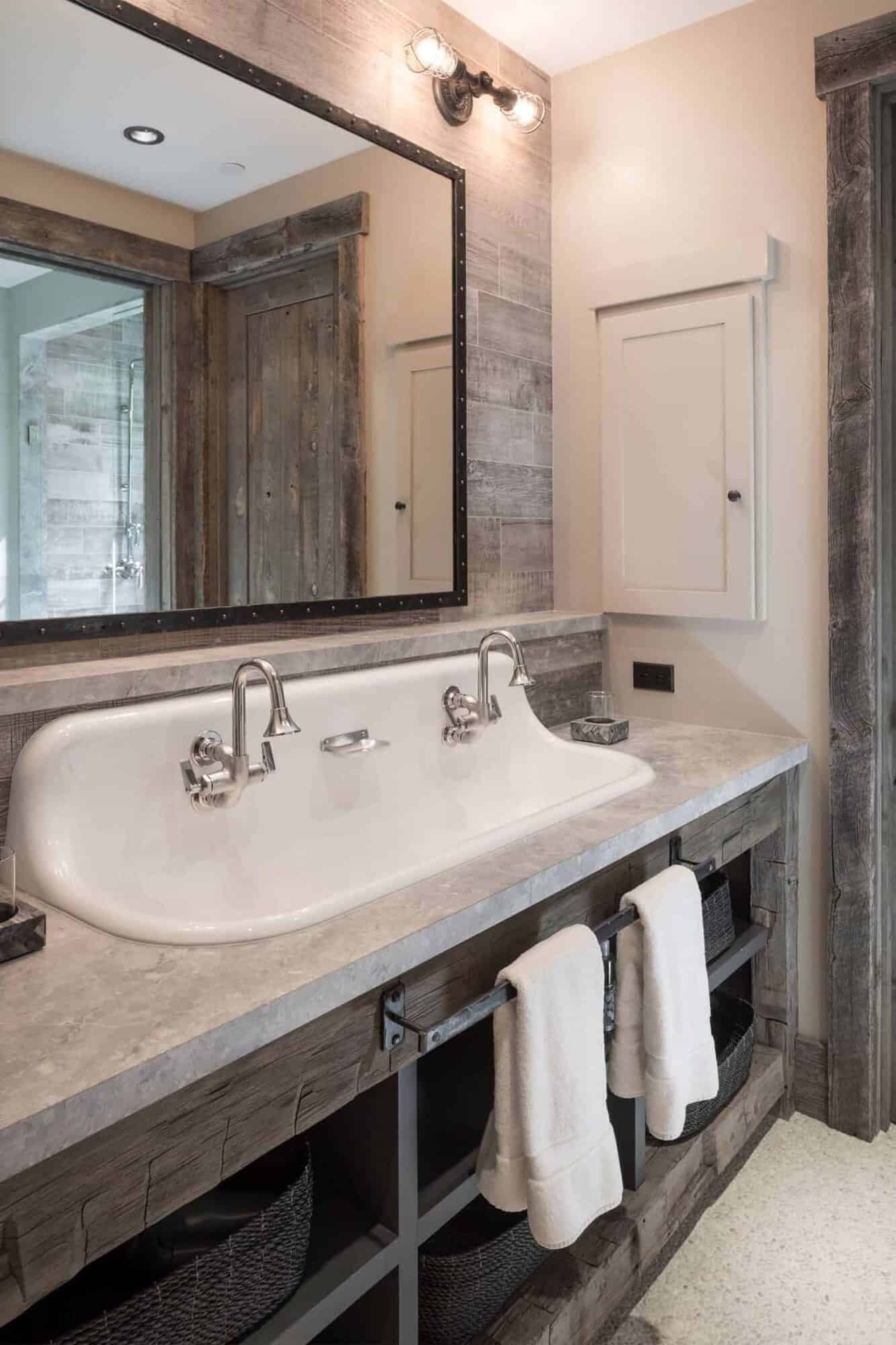 A rustic bathroom with a sink and mirror