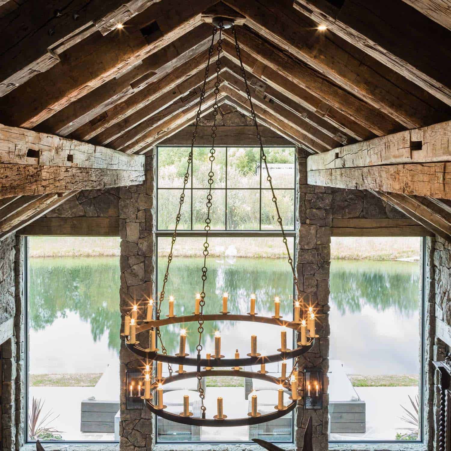 chandelier hanging from the rustic living room ceiling