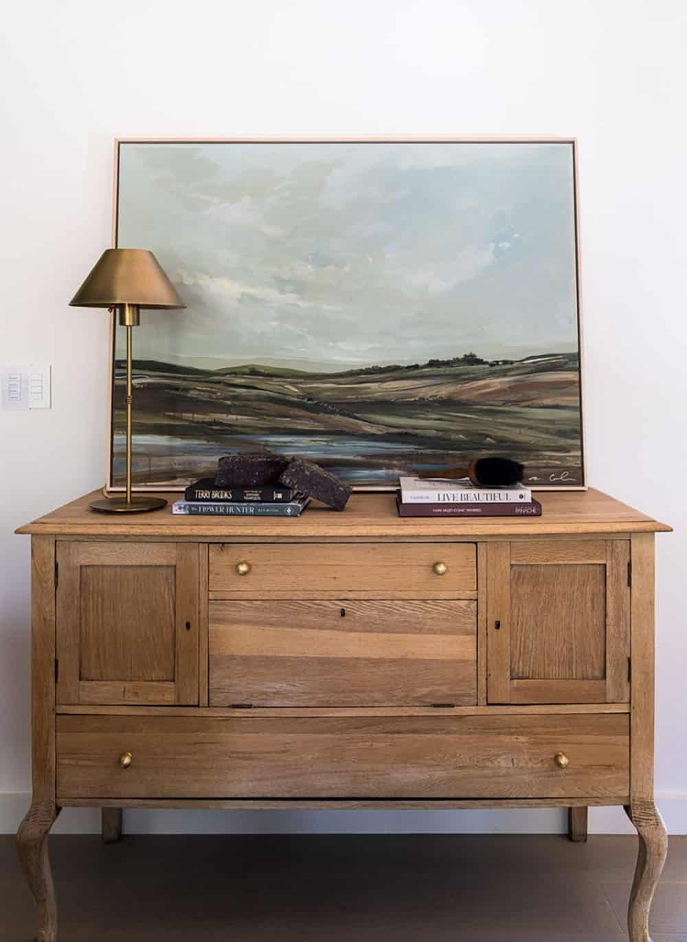 contemporary hallway with a side table and painting