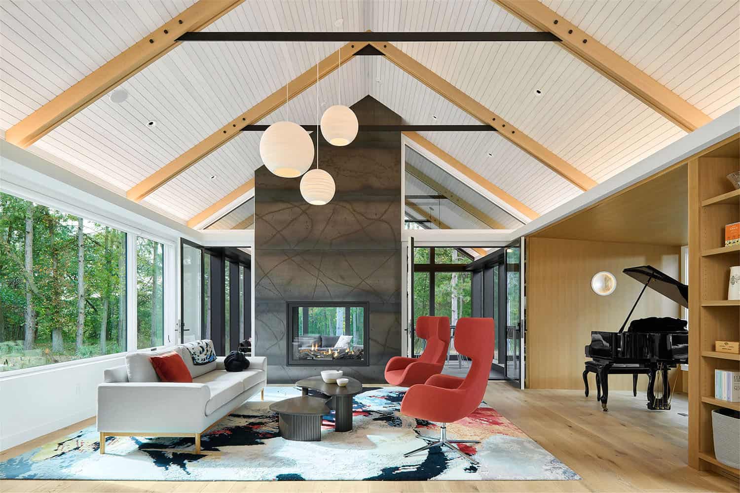 modern living room with a dual-sided fireplace