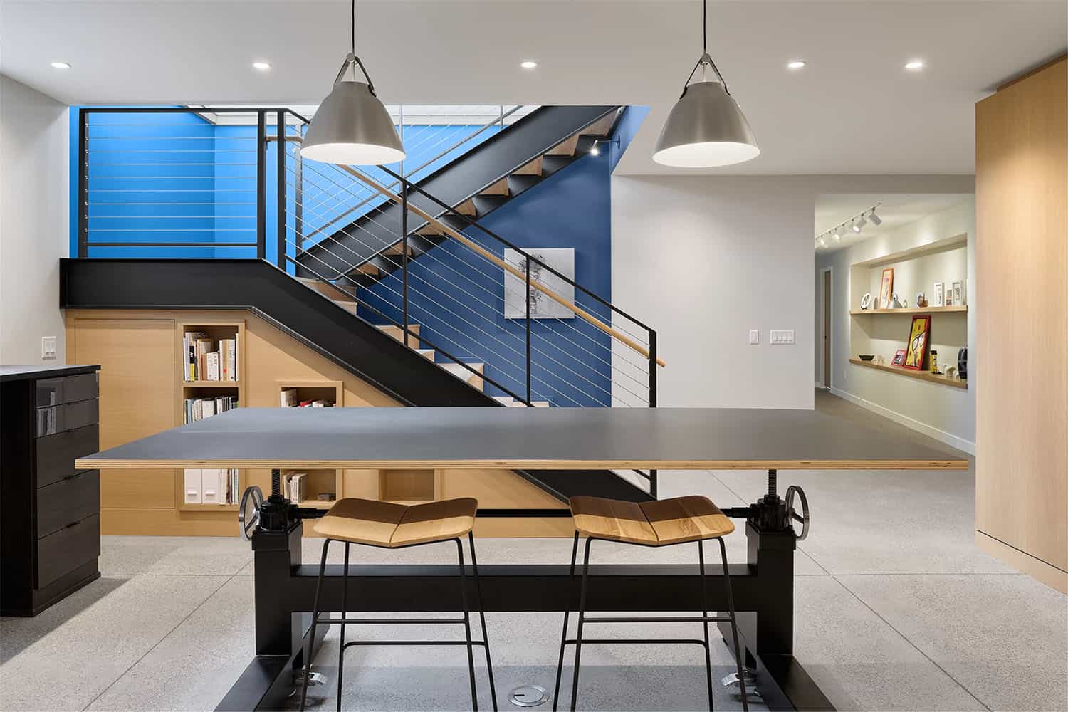 modern staircase to the basement entertainment level