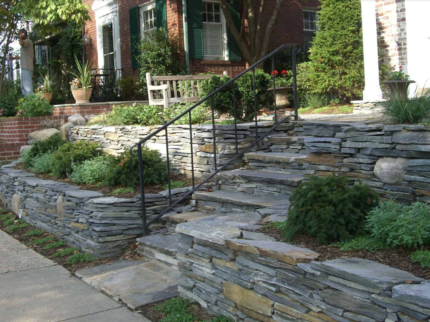 brick townhouse front landscape with raised garden beds