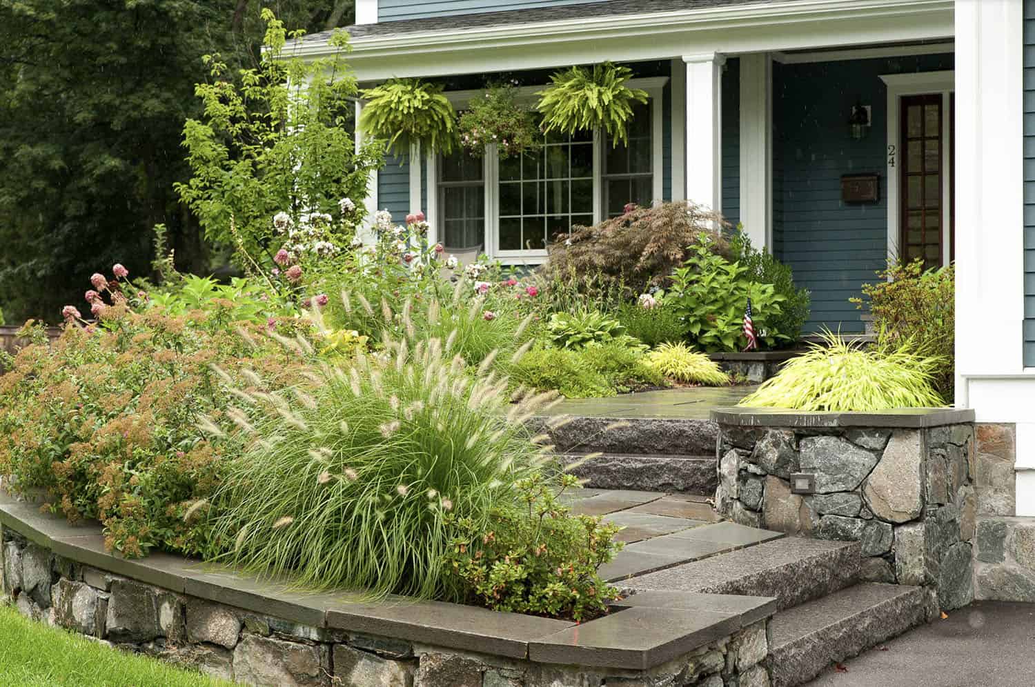 front entrance landscape design with a raised foundation planter