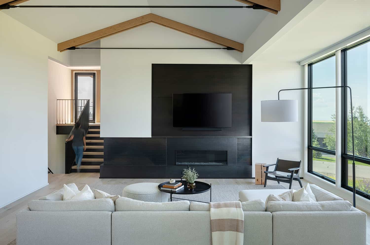 modern living room with a fireplace and tv wall