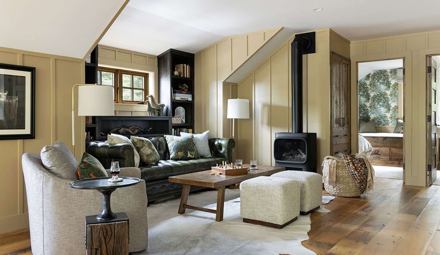 transitional style family room with a wood-burning stove
