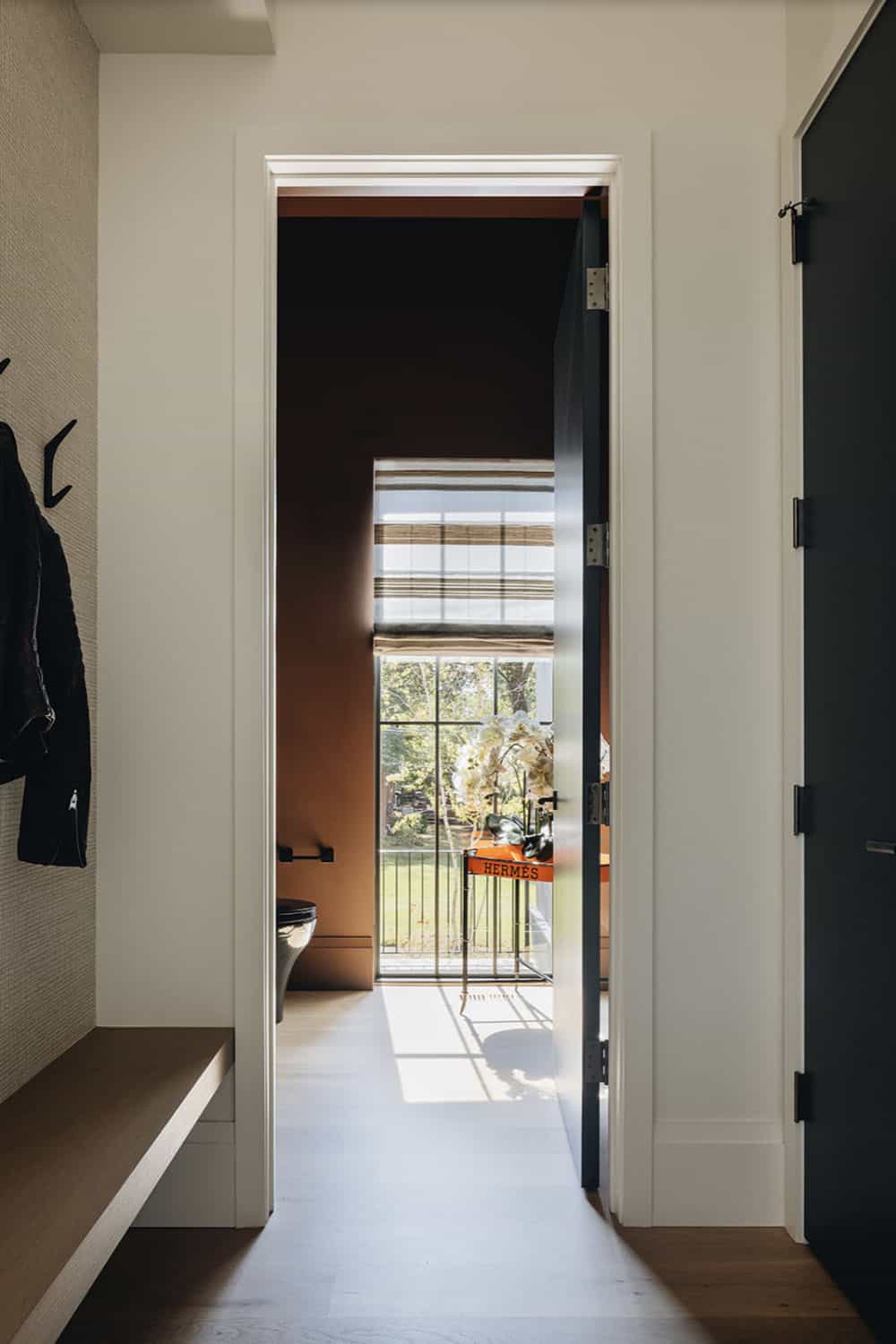transitional hallway with a built-in bench